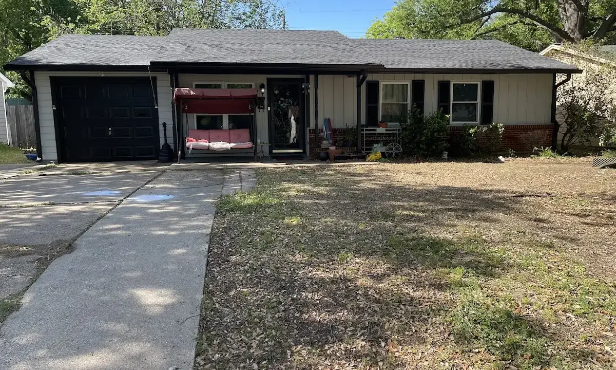 Soffit & Fascia Repair crew at work on a residential roof in Morehead City